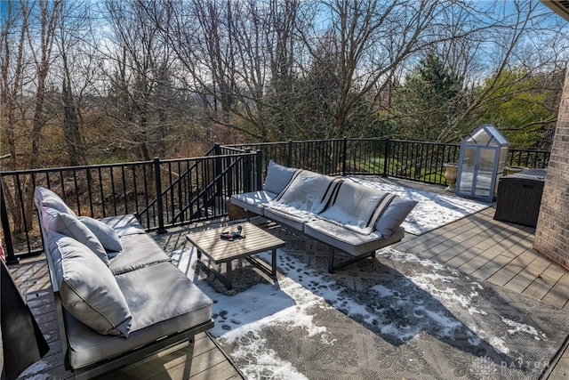 view of patio / terrace with a wooden deck and an outdoor hangout area