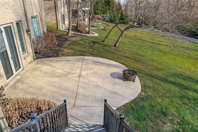 view of patio / terrace with a fire pit