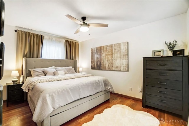 bedroom featuring ceiling fan and dark hardwood / wood-style flooring