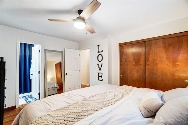 bedroom with ceiling fan, a closet, and dark hardwood / wood-style floors