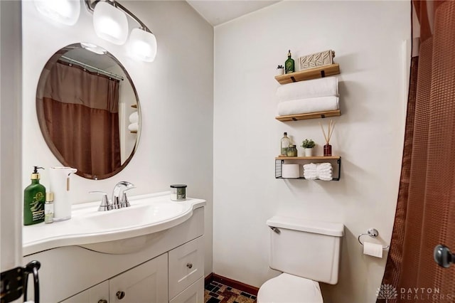 bathroom featuring vanity and toilet