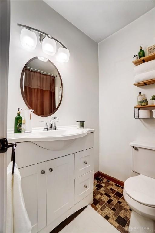 bathroom featuring vanity and toilet