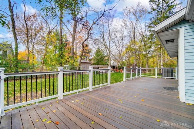 wooden terrace with a lawn