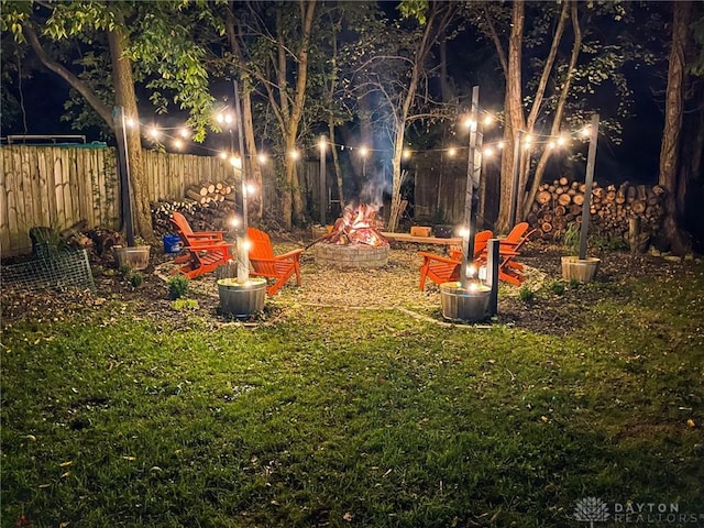 view of yard featuring an outdoor fire pit