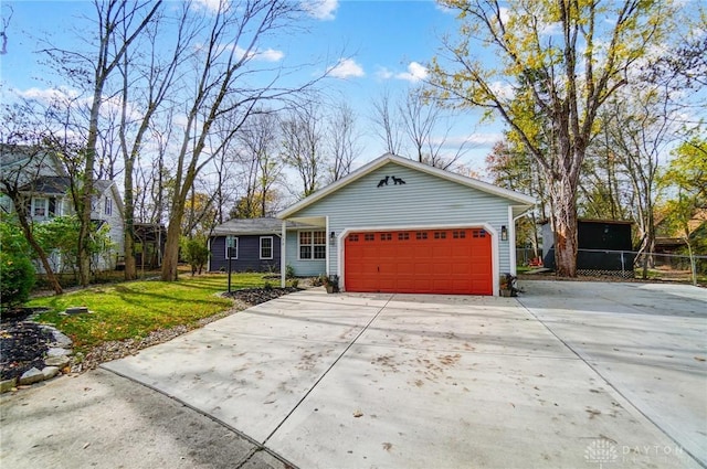 single story home with a front yard and a garage