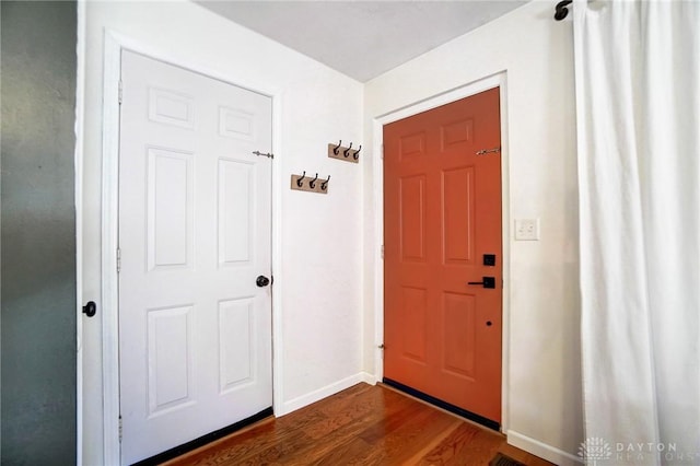 foyer with dark hardwood / wood-style floors