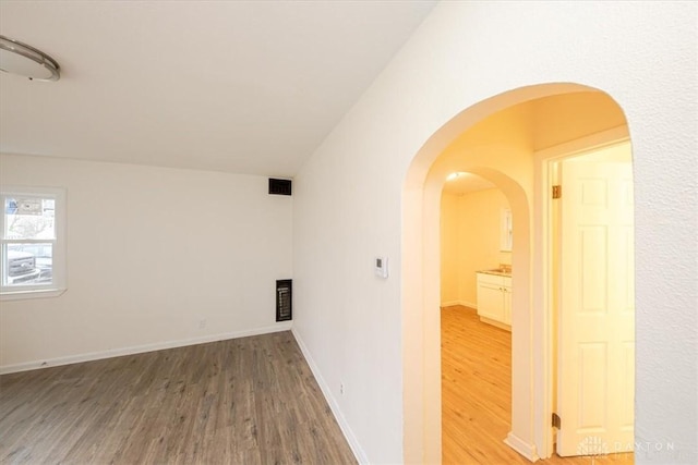 unfurnished room featuring wood-type flooring