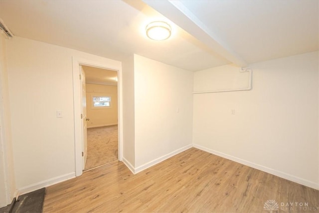 spare room with light wood-type flooring