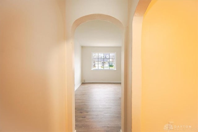 corridor featuring wood-type flooring