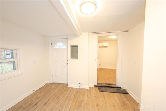 foyer featuring electric panel and light wood-type flooring