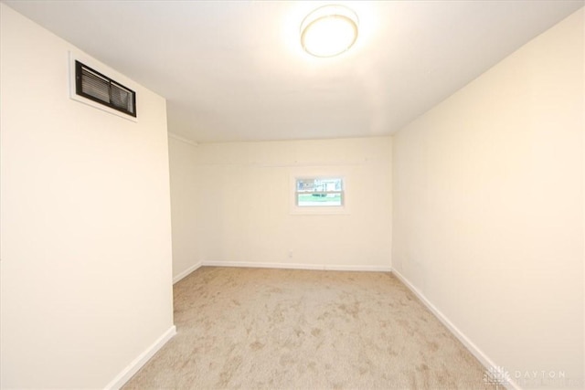 basement with light colored carpet