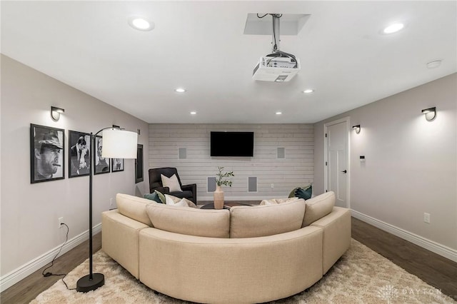 cinema room with wood-type flooring