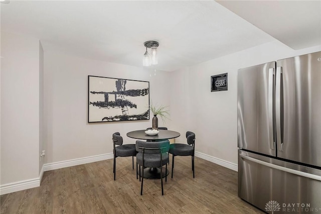 dining area featuring hardwood / wood-style floors