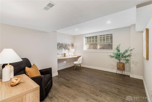 living area with dark wood-type flooring