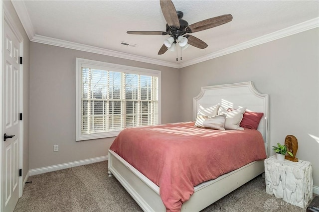 carpeted bedroom with ceiling fan and crown molding