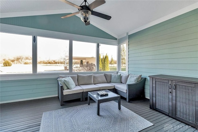 sunroom featuring ceiling fan and lofted ceiling