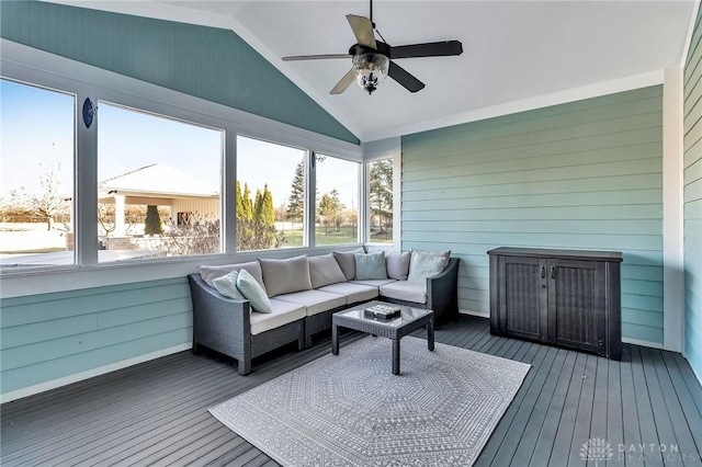 sunroom featuring a wealth of natural light, ceiling fan, and vaulted ceiling