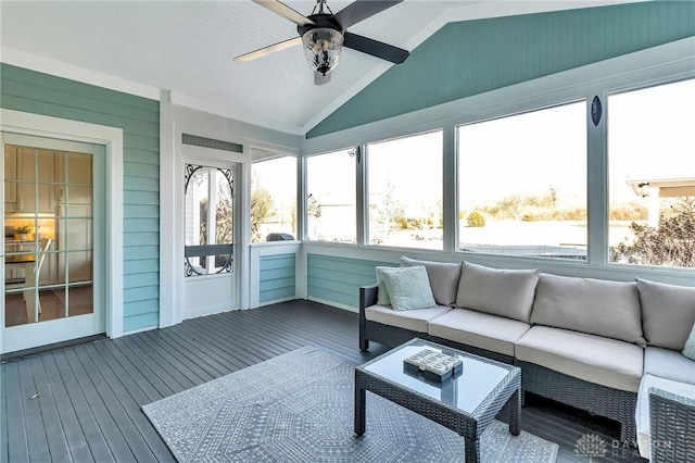 sunroom / solarium with ceiling fan and vaulted ceiling