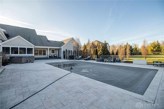 view of pool featuring a patio area and a hot tub