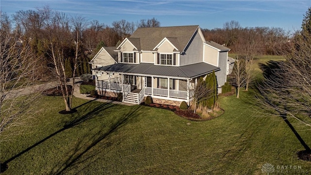 view of front of property featuring a porch and a front yard