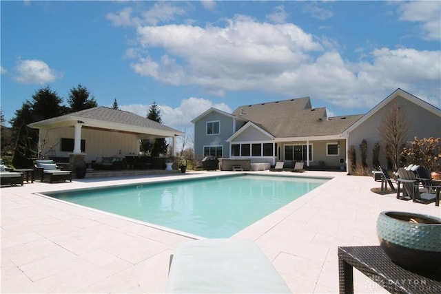 view of pool featuring an outdoor living space and a patio