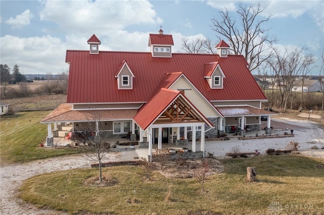 view of front of house featuring a porch and a front yard