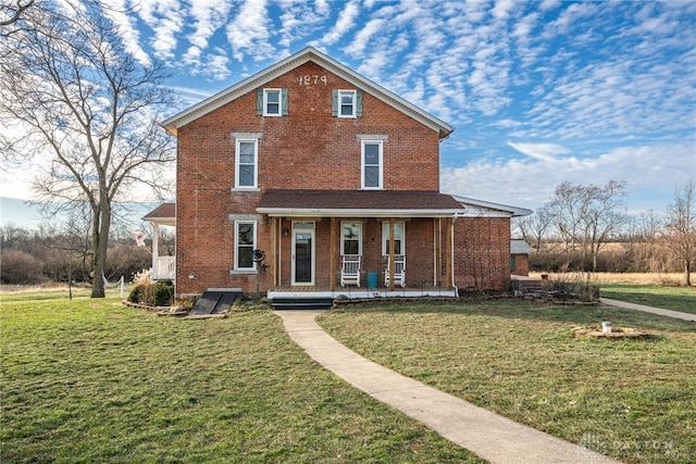 view of front of house with a front lawn and covered porch