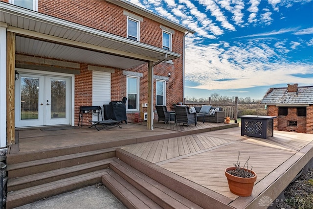 deck with outdoor lounge area and french doors