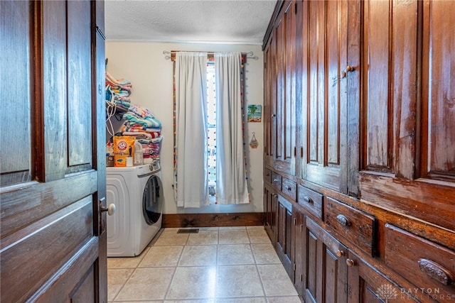 laundry room with washer / clothes dryer, a textured ceiling, and ornamental molding