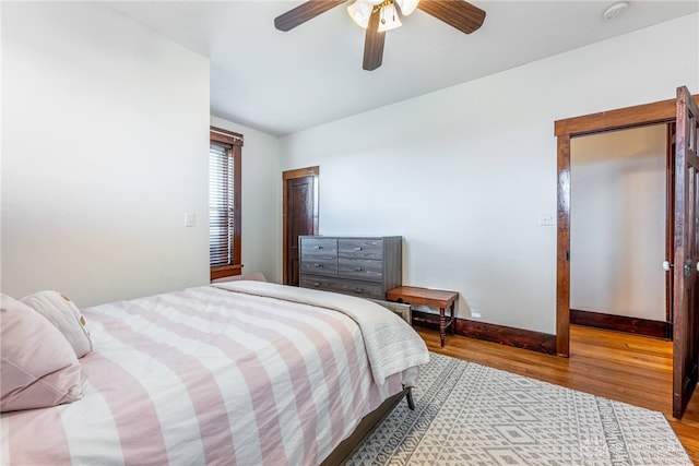 bedroom featuring hardwood / wood-style flooring and ceiling fan