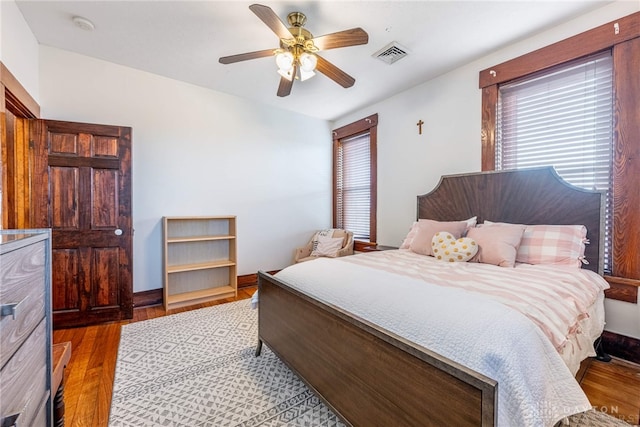 bedroom with ceiling fan and light wood-type flooring