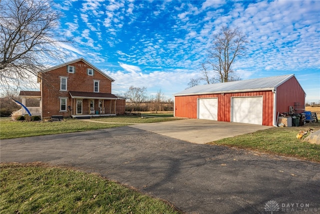 exterior space with a lawn and a porch