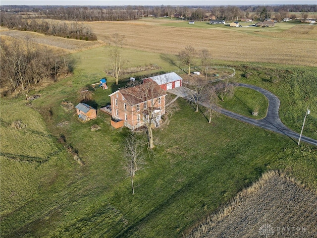 birds eye view of property with a rural view