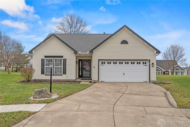 ranch-style home featuring a front lawn and a garage