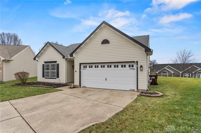 view of front of property with a front yard and a garage