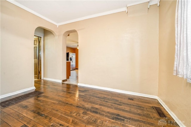 unfurnished room with dark hardwood / wood-style floors and ornamental molding