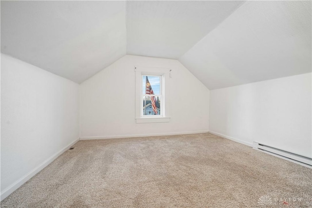 bonus room featuring carpet, a baseboard heating unit, and lofted ceiling