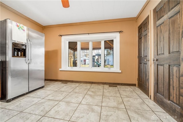 interior space with stainless steel fridge with ice dispenser, ceiling fan, and ornamental molding