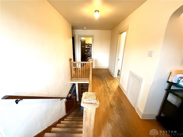 stairs with wood-type flooring