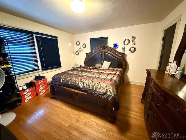 bedroom with hardwood / wood-style flooring