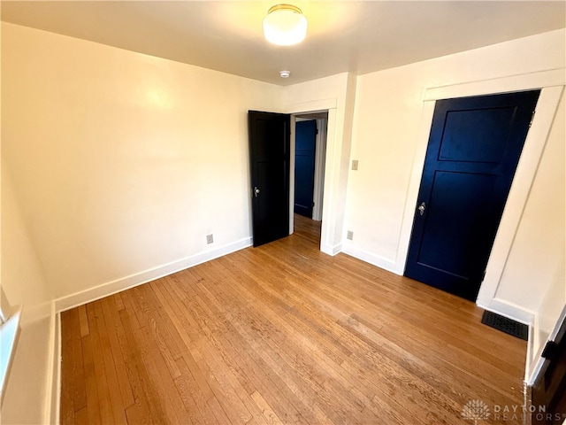 unfurnished bedroom featuring light hardwood / wood-style flooring