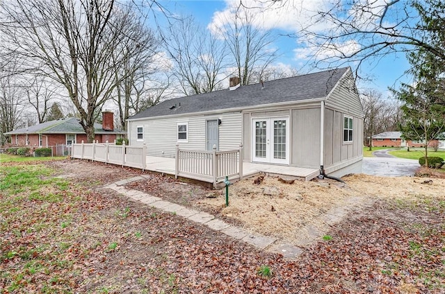 rear view of house featuring french doors