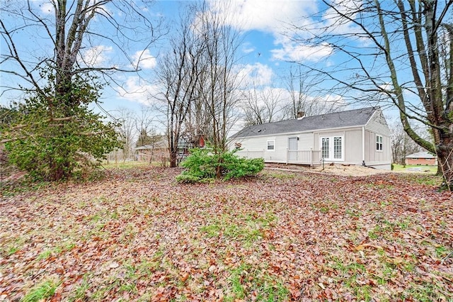 view of yard with french doors