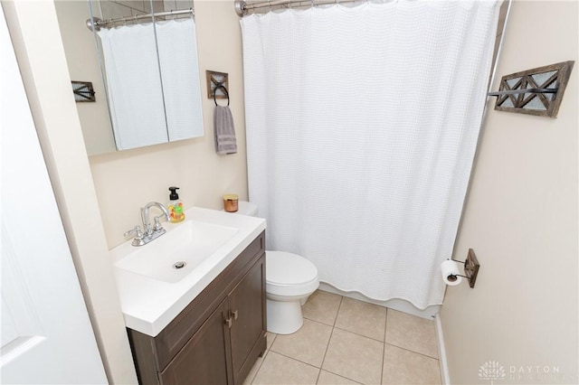 bathroom featuring vanity, tile patterned flooring, toilet, and shower / bathtub combination with curtain