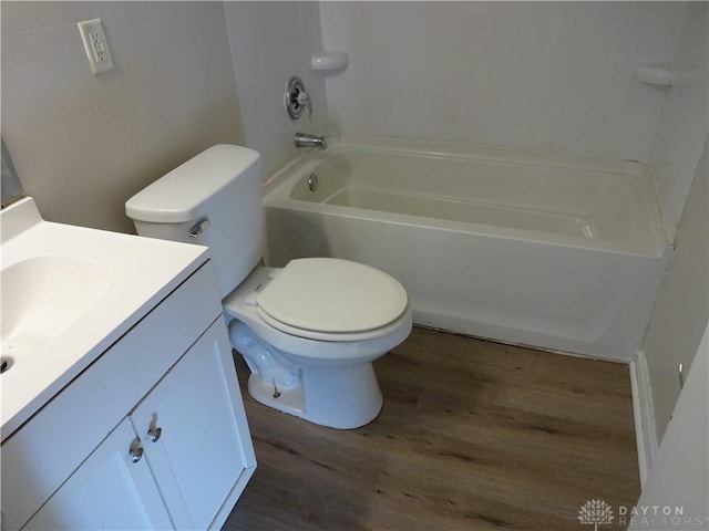 bathroom featuring hardwood / wood-style floors, vanity, and toilet