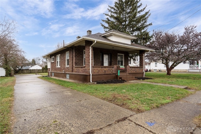 bungalow-style house featuring a front yard and a porch