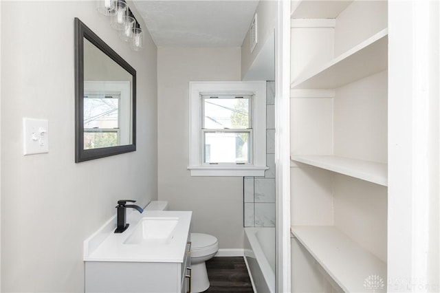 bathroom featuring vanity, toilet, and wood-type flooring