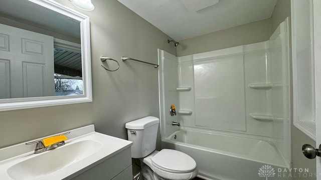 full bathroom with vanity,  shower combination, and toilet