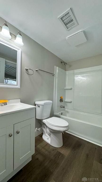 full bathroom featuring shower / bath combination, vanity, toilet, and wood-type flooring