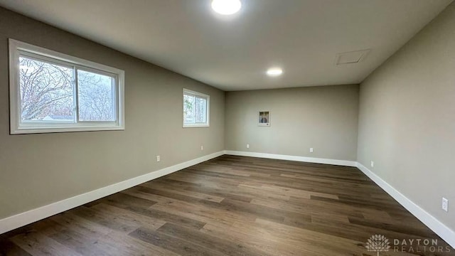 empty room featuring dark wood-type flooring